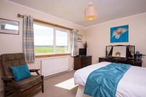 Image of self catering cottage master bedroom and southerly view